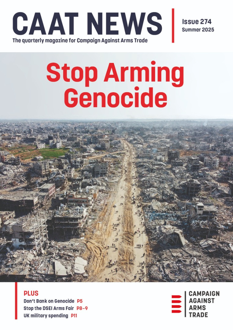 Hundreds of people walk down a sandy road which has on both sides the ruins of an utterly destroyed city.