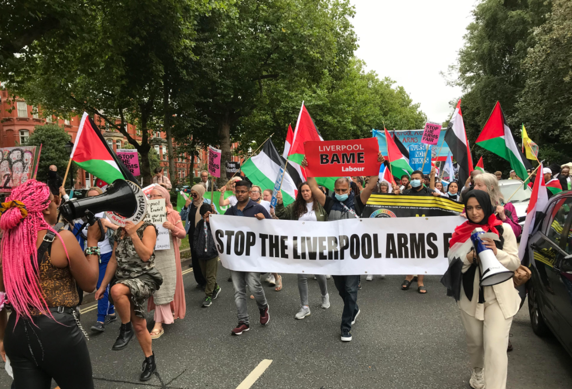 march with Palestinian flags and banner reads 'Stop the Liverpool Arms Fair'