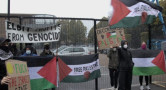 Image of a small protest blocking an arms factory.